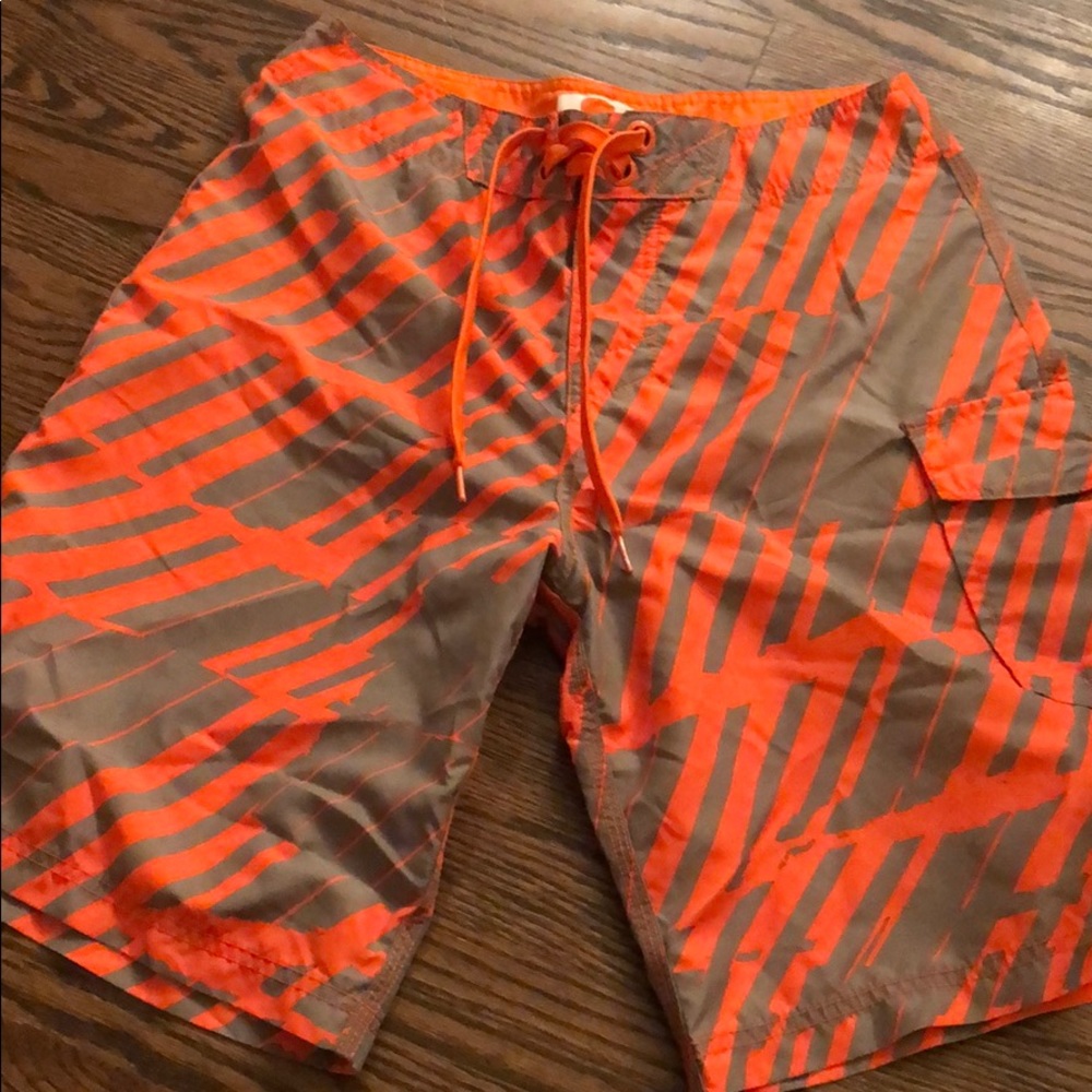Orange and grey swim shorts